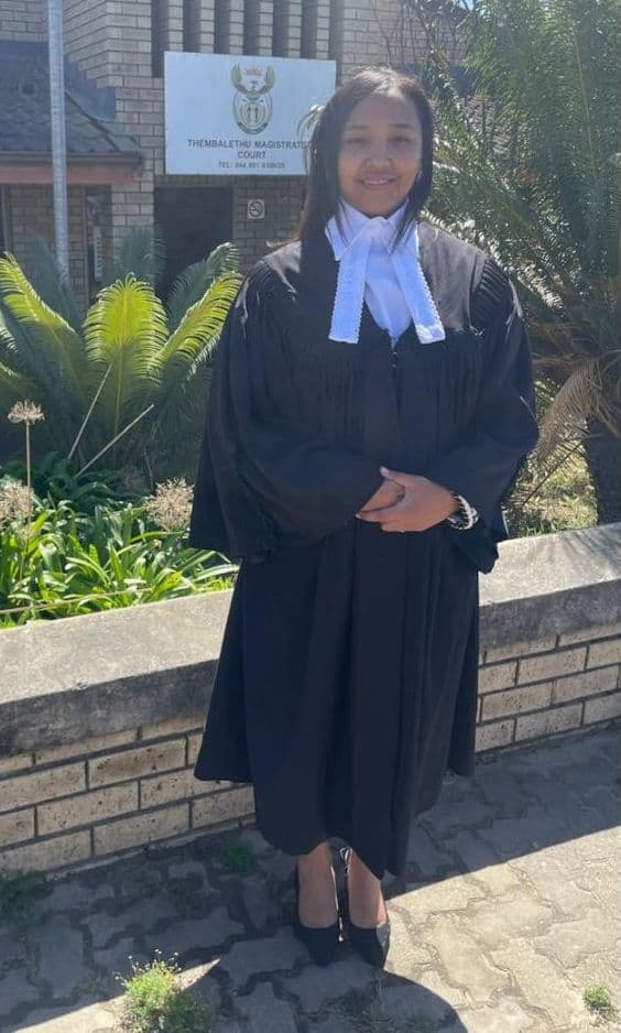 Leonore Swart in court robes outside Thembalethu Magistrate's Court